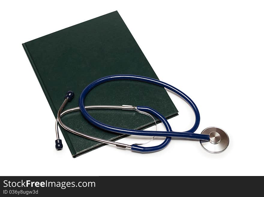 Stethoscope and a book on a white background. Stethoscope and a book on a white background.