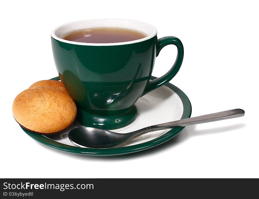 Cup of tea and biscuit isolated on white background