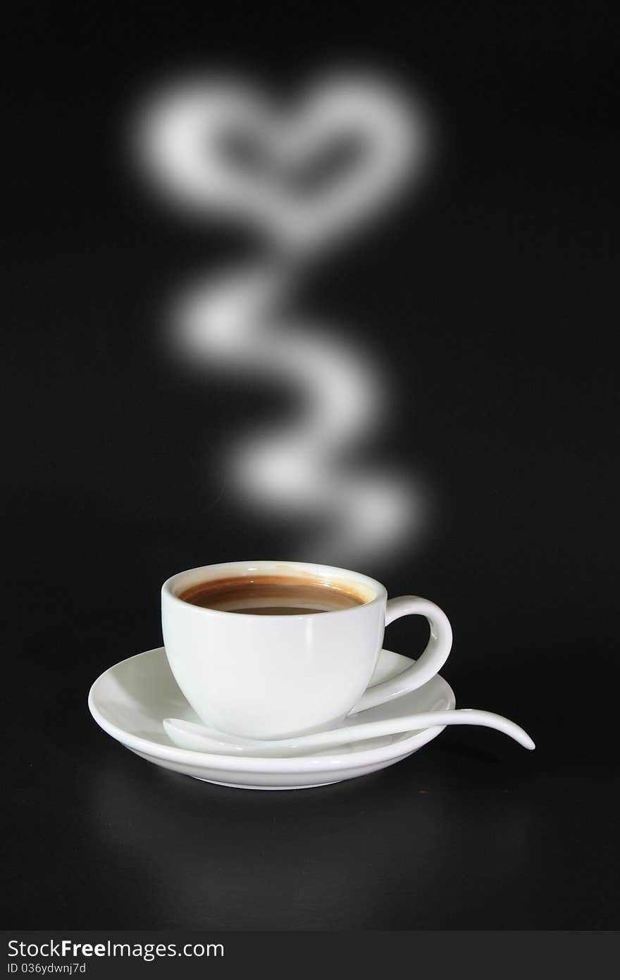 A cup of coffee isolated on black background. A cup of coffee isolated on black background