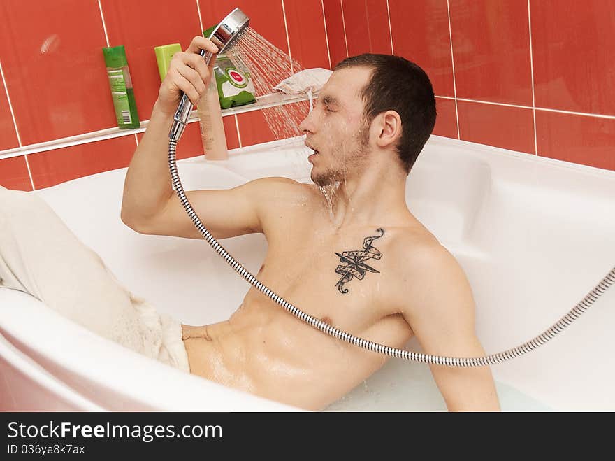 Drunken man in the tub wearing underpants