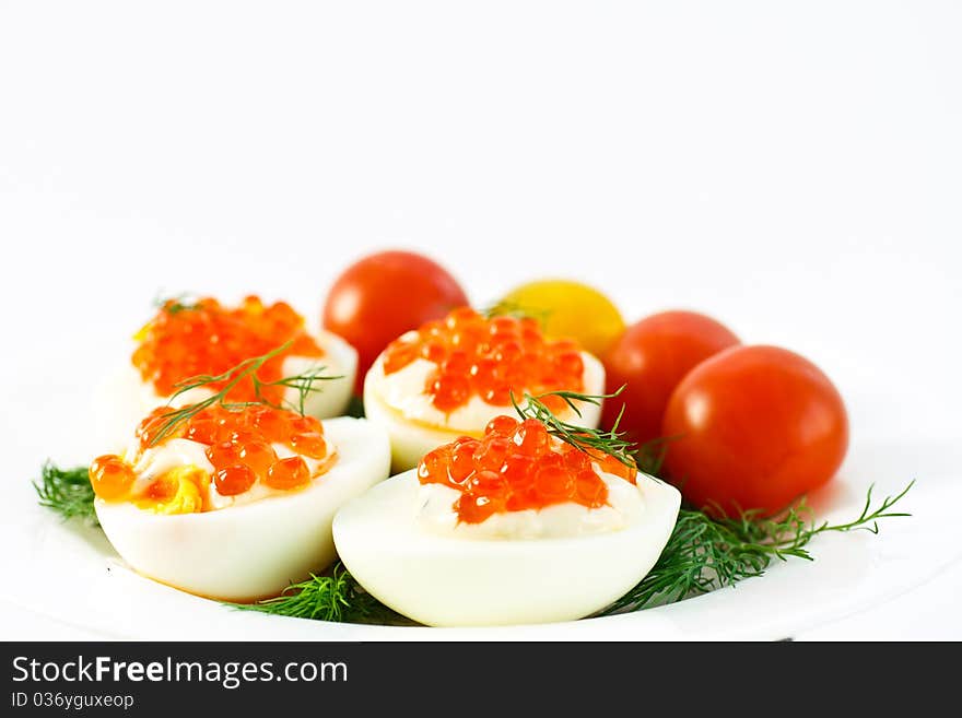 Eggs with caviar and dill tomatoes. Eggs with caviar and dill tomatoes