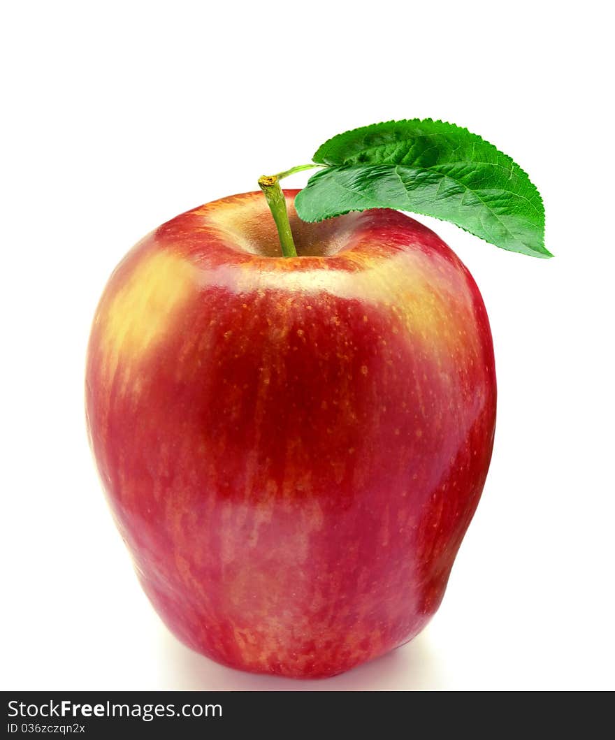 Red fresh apple with green leaf