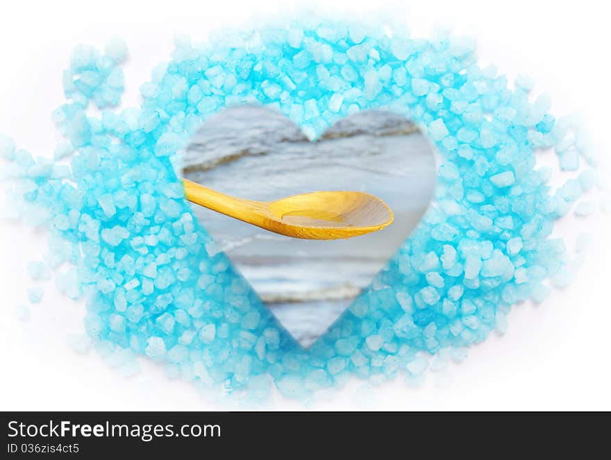 Blue bath salt and sea water in a spoon. Blue bath salt and sea water in a spoon.