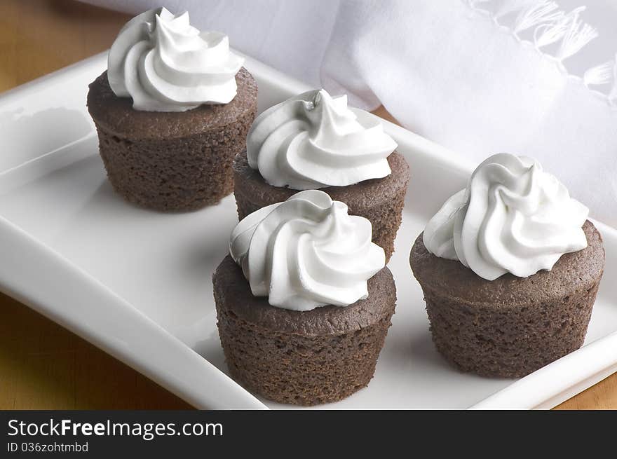 Muffins in decorated white plate