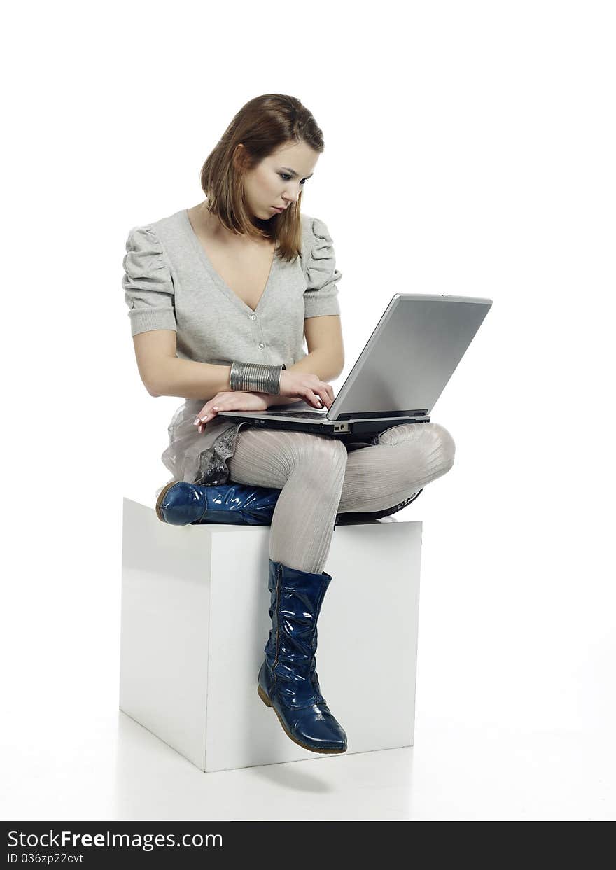 Casually dressed young woman surfing the net. Casually dressed young woman surfing the net