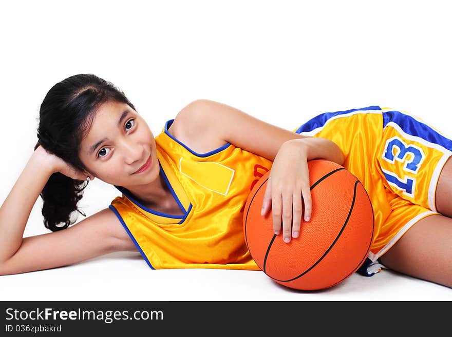 Young asian pretty basketball player in white background. Young asian pretty basketball player in white background.