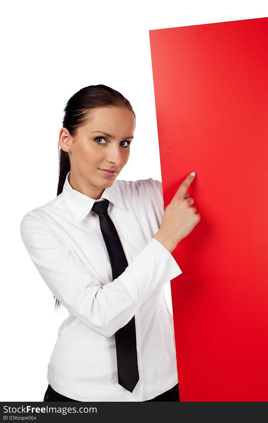 Young woman pointing at red billboard. Isolated on white background