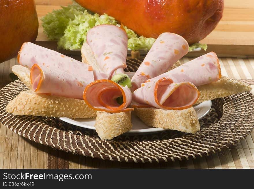 Slices Galantine of chicken with lettuce and bread