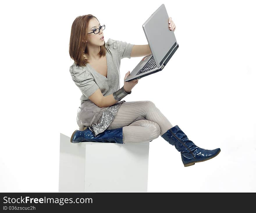 Young woman looking at her laptop monitor. Young woman looking at her laptop monitor