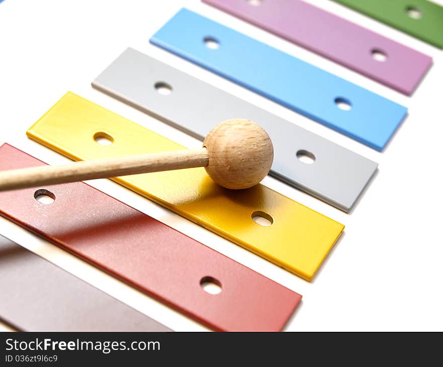 A colourful glockenspiel on white background