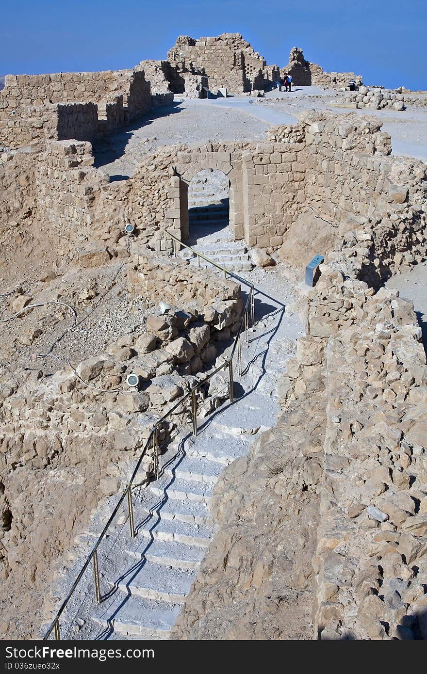 The footpath and the gate leading to Masada from the roman ramp - Israel. The footpath and the gate leading to Masada from the roman ramp - Israel.