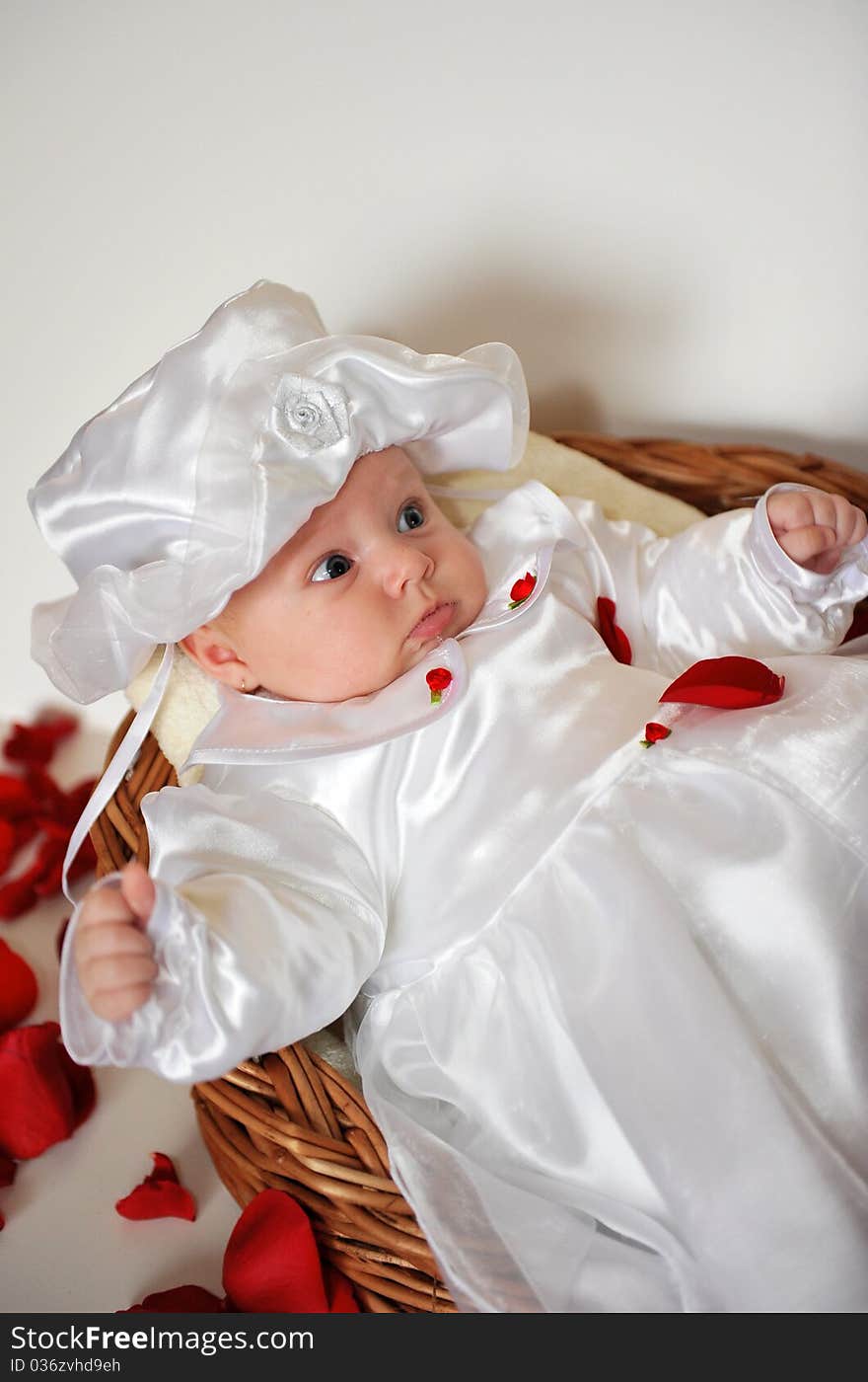 Portrait with little baby girl in a basket