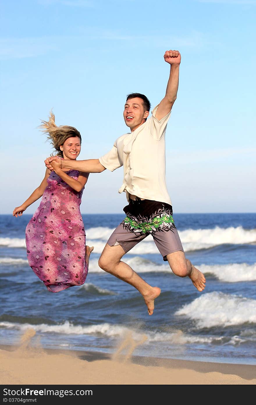 Couple on the shore of the sea. Couple on the shore of the sea