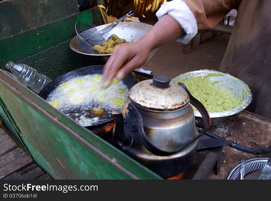 Fresh fritters of chickpeas food being prepared at roadside street restaurant in a egyptian village