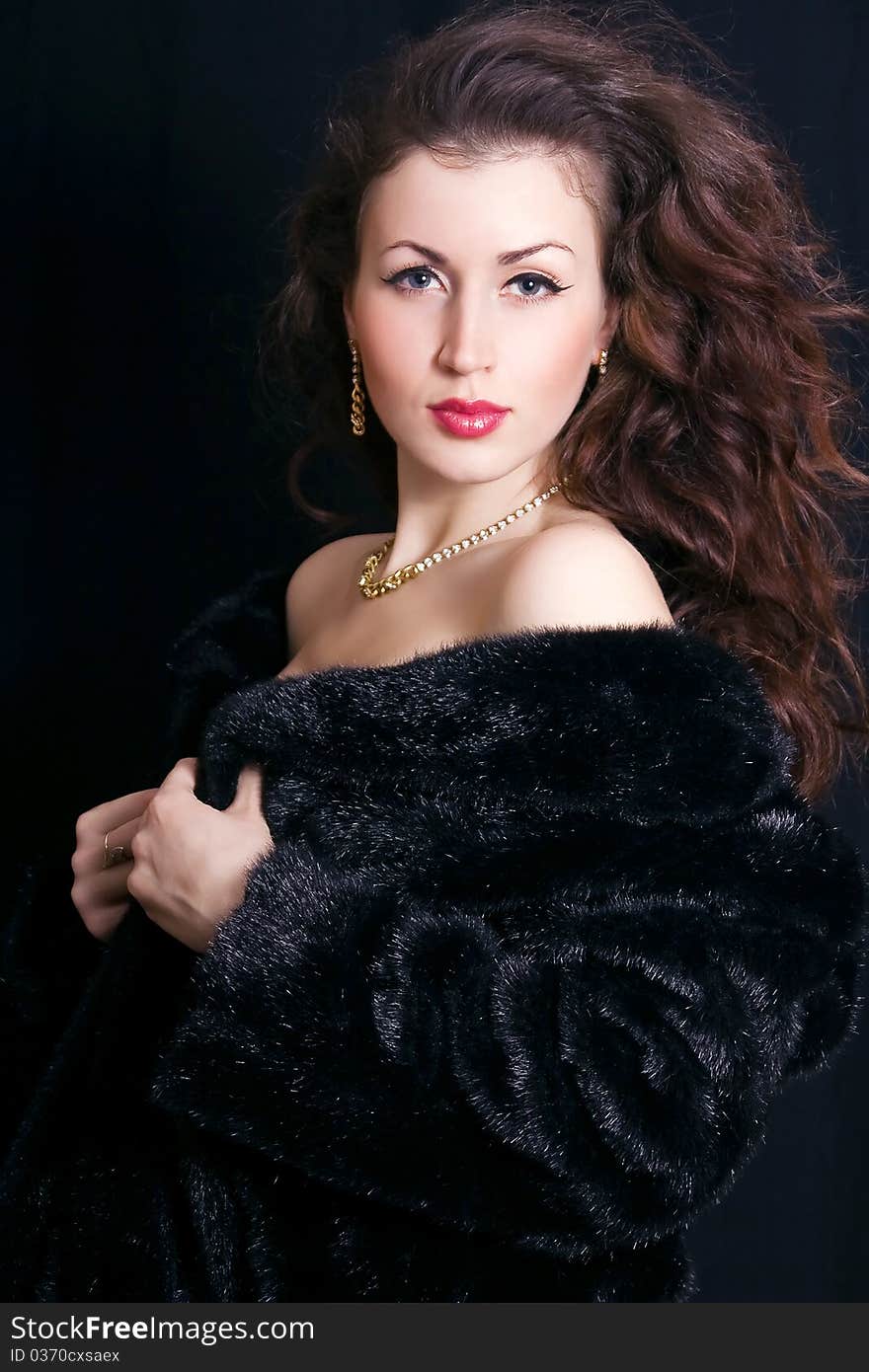 Beautiful woman in a black fur