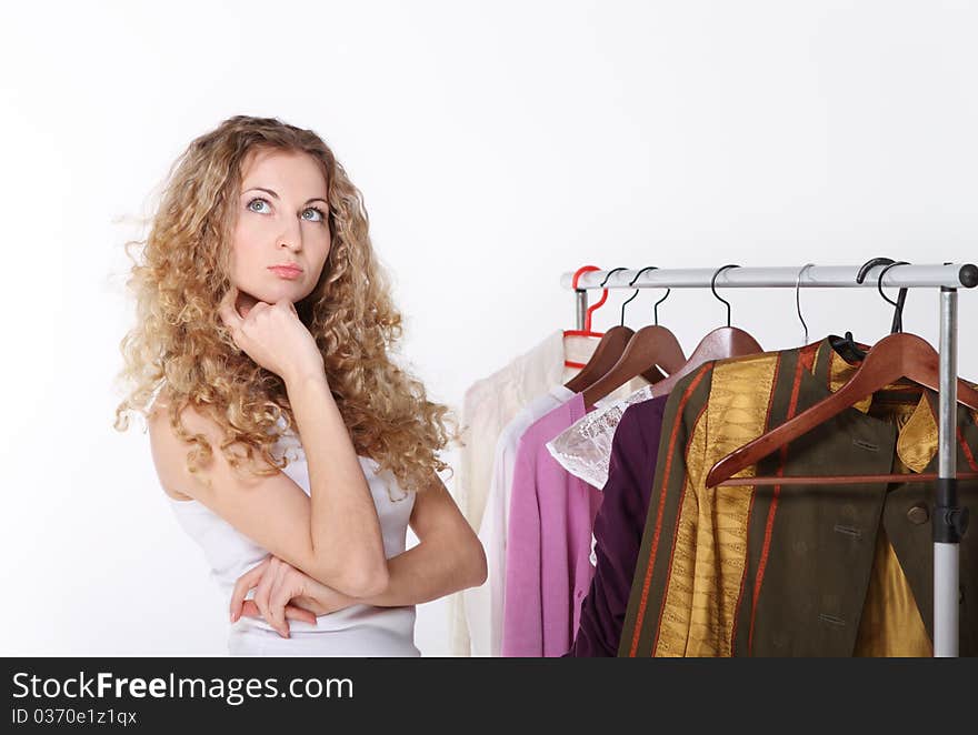 Girl selecting clothes in shop