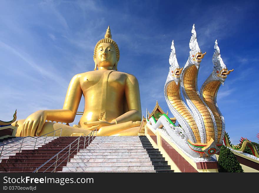 Big golden buddha with blue sky.