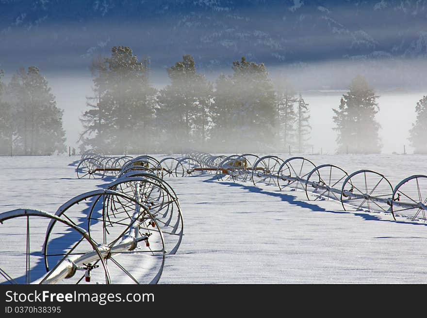 This image of the fog layers with the irrigation pipes in the foreground was taken in NW Montana. This image of the fog layers with the irrigation pipes in the foreground was taken in NW Montana.