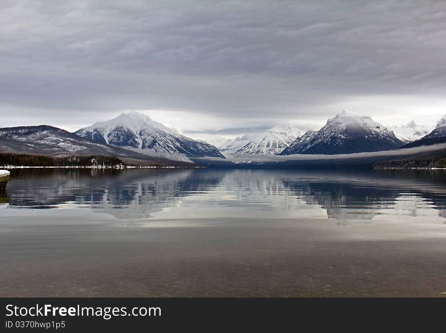 This image of the lake reflection was taken on a gray, snowy, cold day in NW Montana.