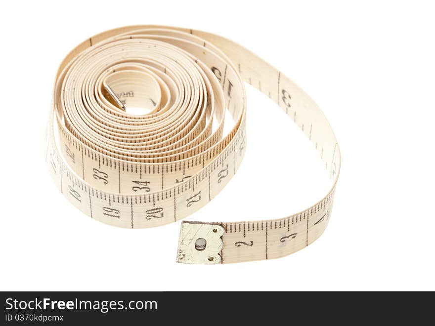 Light measuring tape isolated on a white background. Symbol of a healthy lifestyle and fight obesity