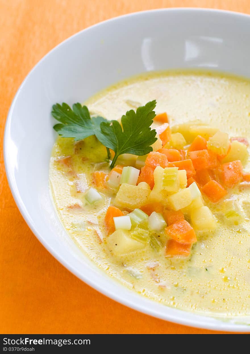 Vegetable soup with carrot, cabbage and potatoes in bowl