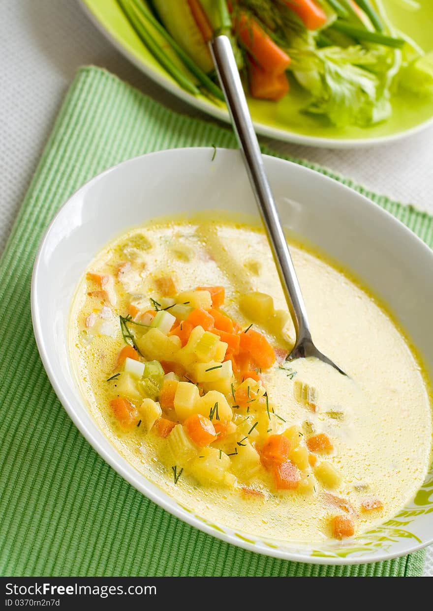 Vegetable soup with carrot, cabbage and potatoes in bowl