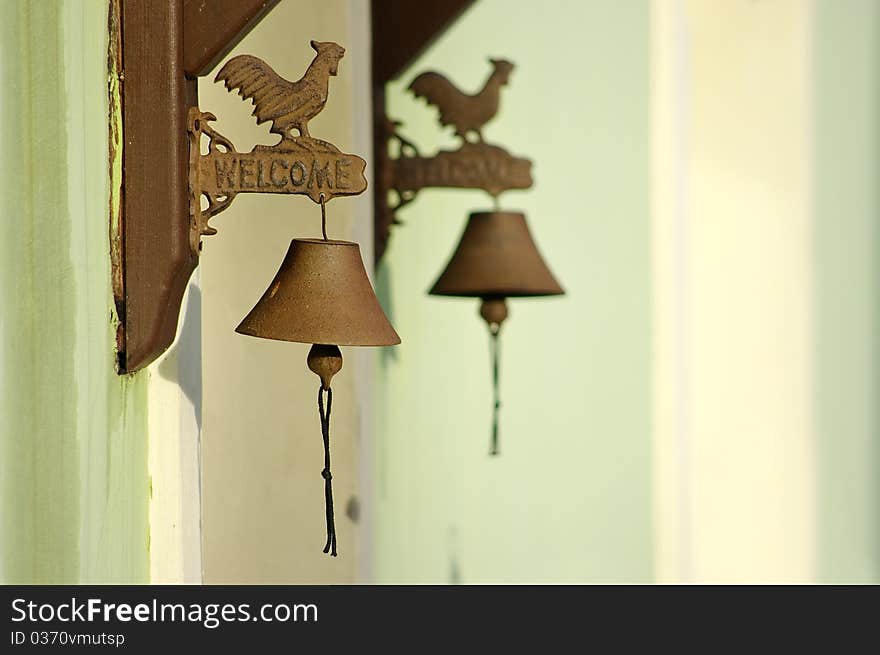 Two bells near entrance to house