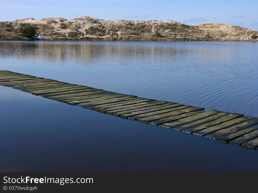 A path across the flooded dunes