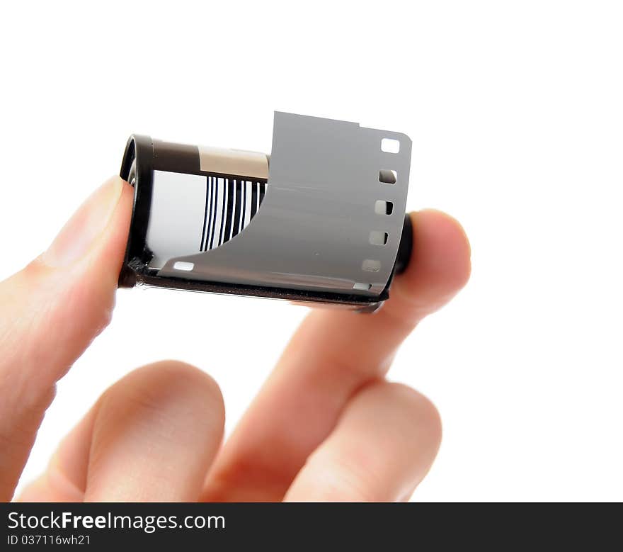 Hand holding an old 35mm film canister isolated on white background. Hand holding an old 35mm film canister isolated on white background