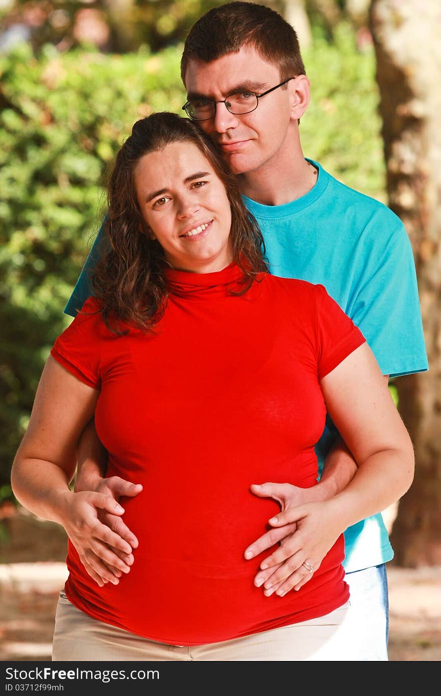 Portrait of a Expecting couple on the park