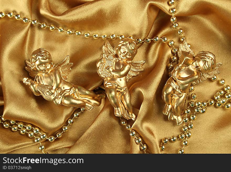 Three small gold angel