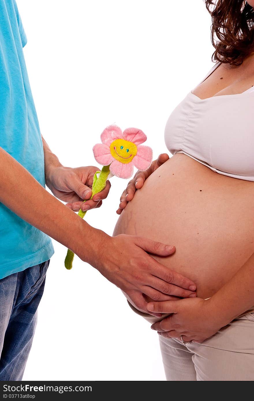 Expecting couple male giving a pink flower