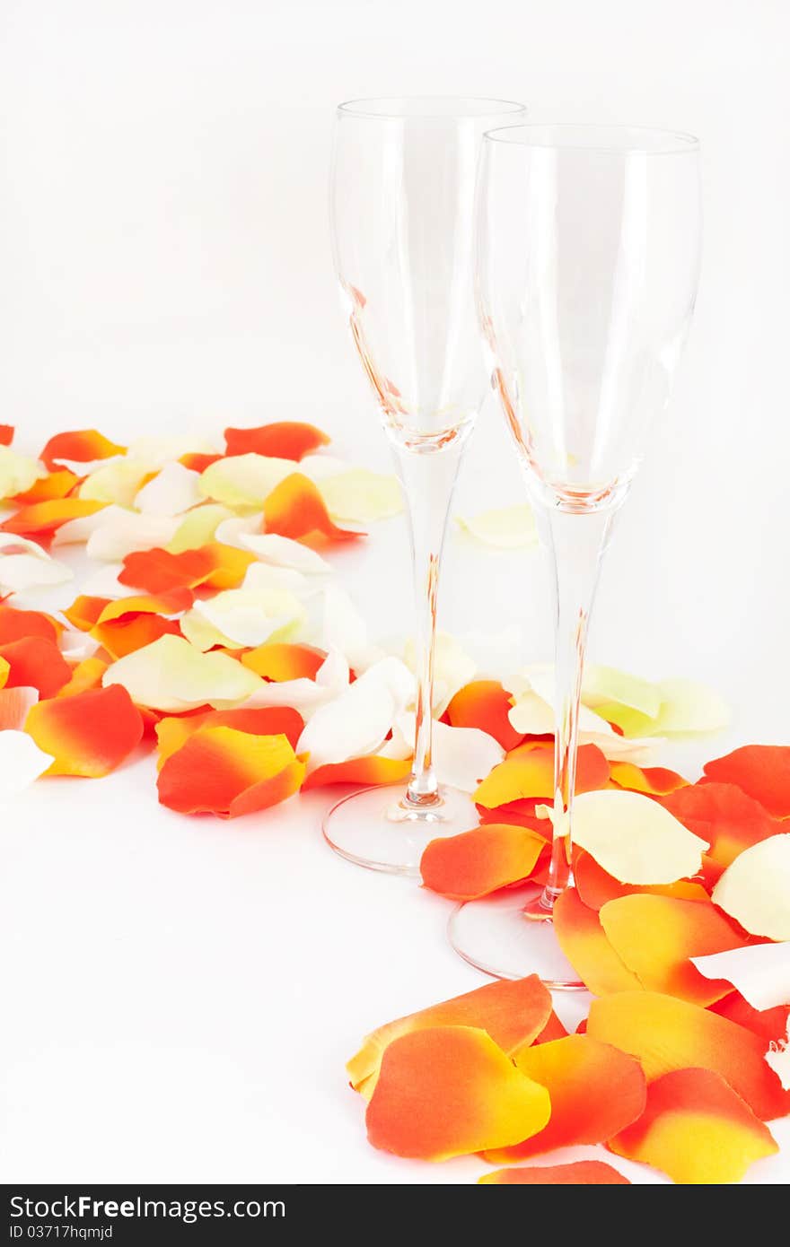 Glasses On The Background Of Rose Petals