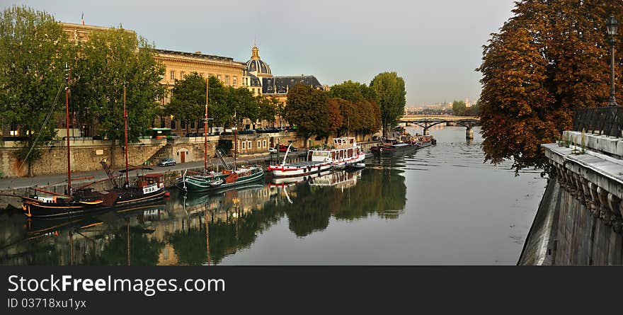 View of Seine riverside, early morning, Institute de France and Pont des Arts from Pont Neuf, Paris