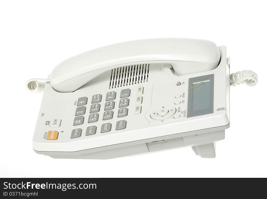 White office telephone on a white background. White office telephone on a white background