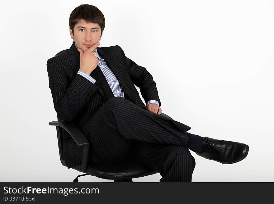 Businessman sitting in an armchair