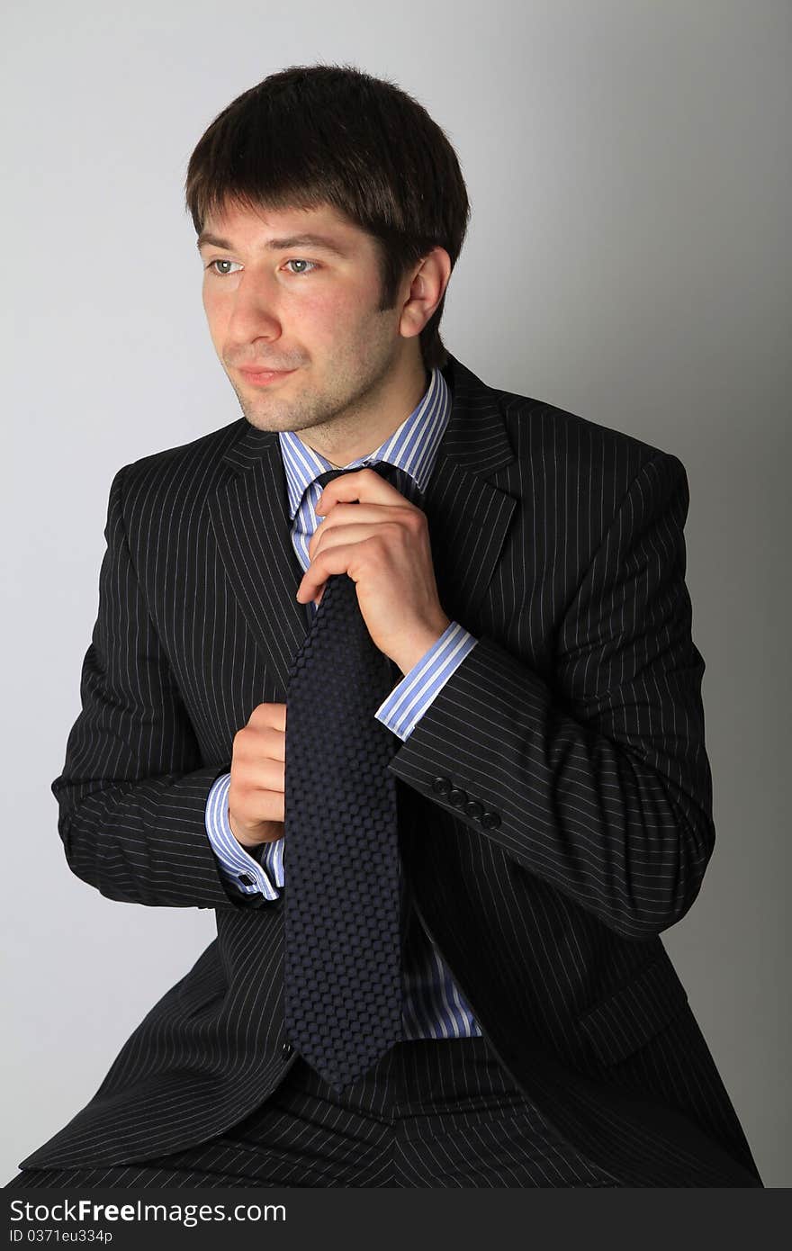 Man tying necktie