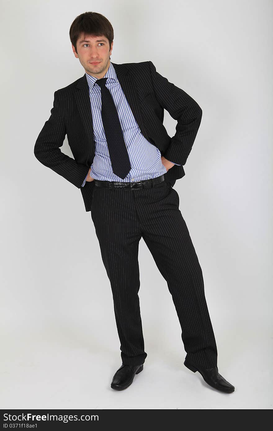 Man in a business suit in a full length