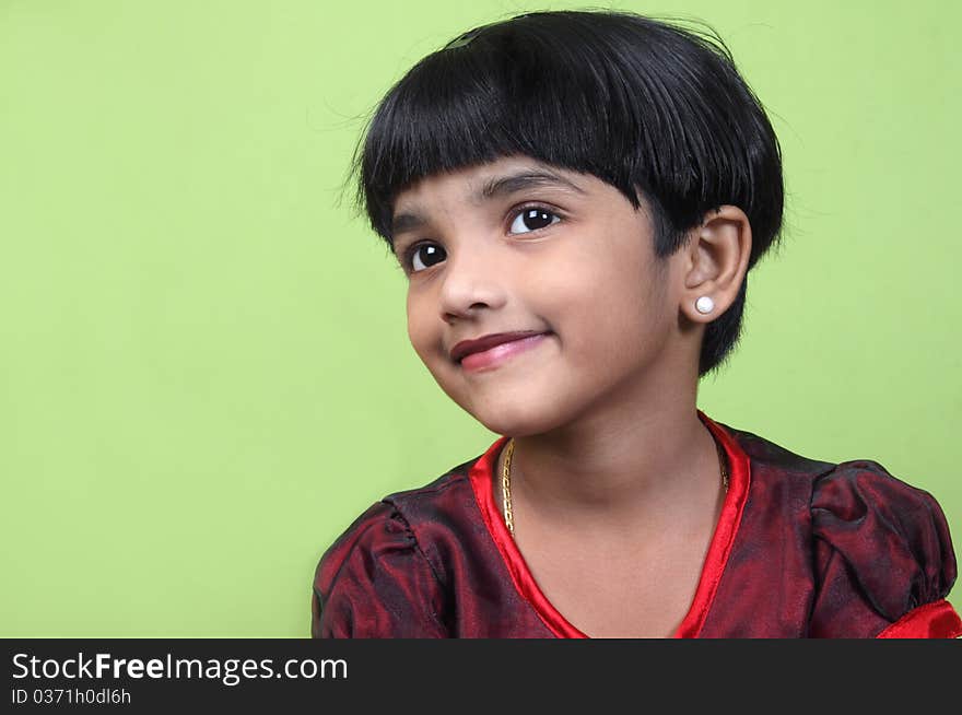 Portrait of Cute Indian little girl looking somewhere