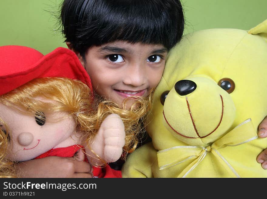 Indian Little Girl Holding The Dolls