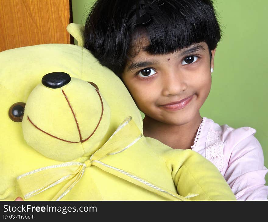 Indian Little Girl Holding The Ctue Doll. Indian Little Girl Holding The Ctue Doll