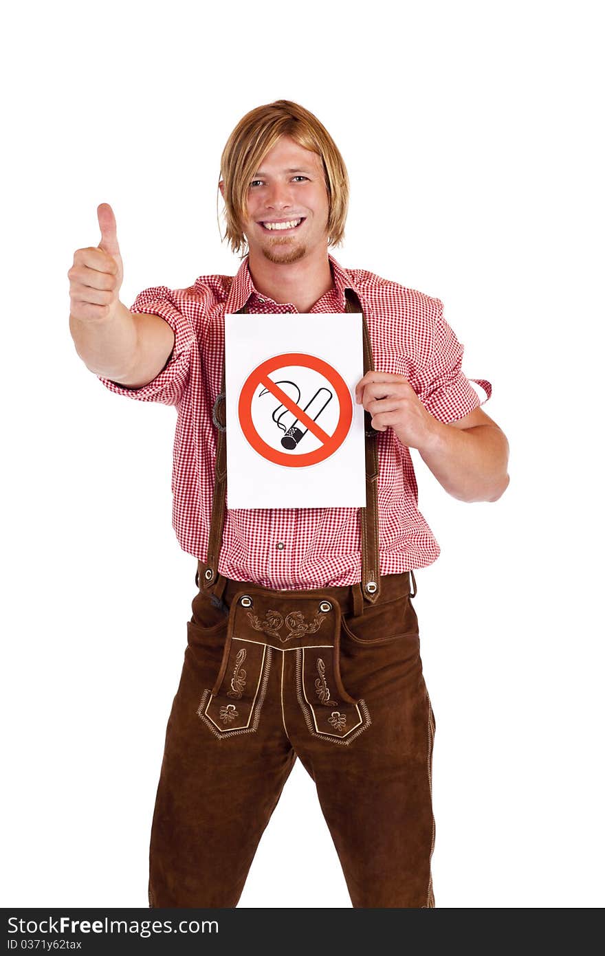 Smiling Bavarian man in lederhose agrees to non-smoking-rule. Isolated on white background. Smiling Bavarian man in lederhose agrees to non-smoking-rule. Isolated on white background.