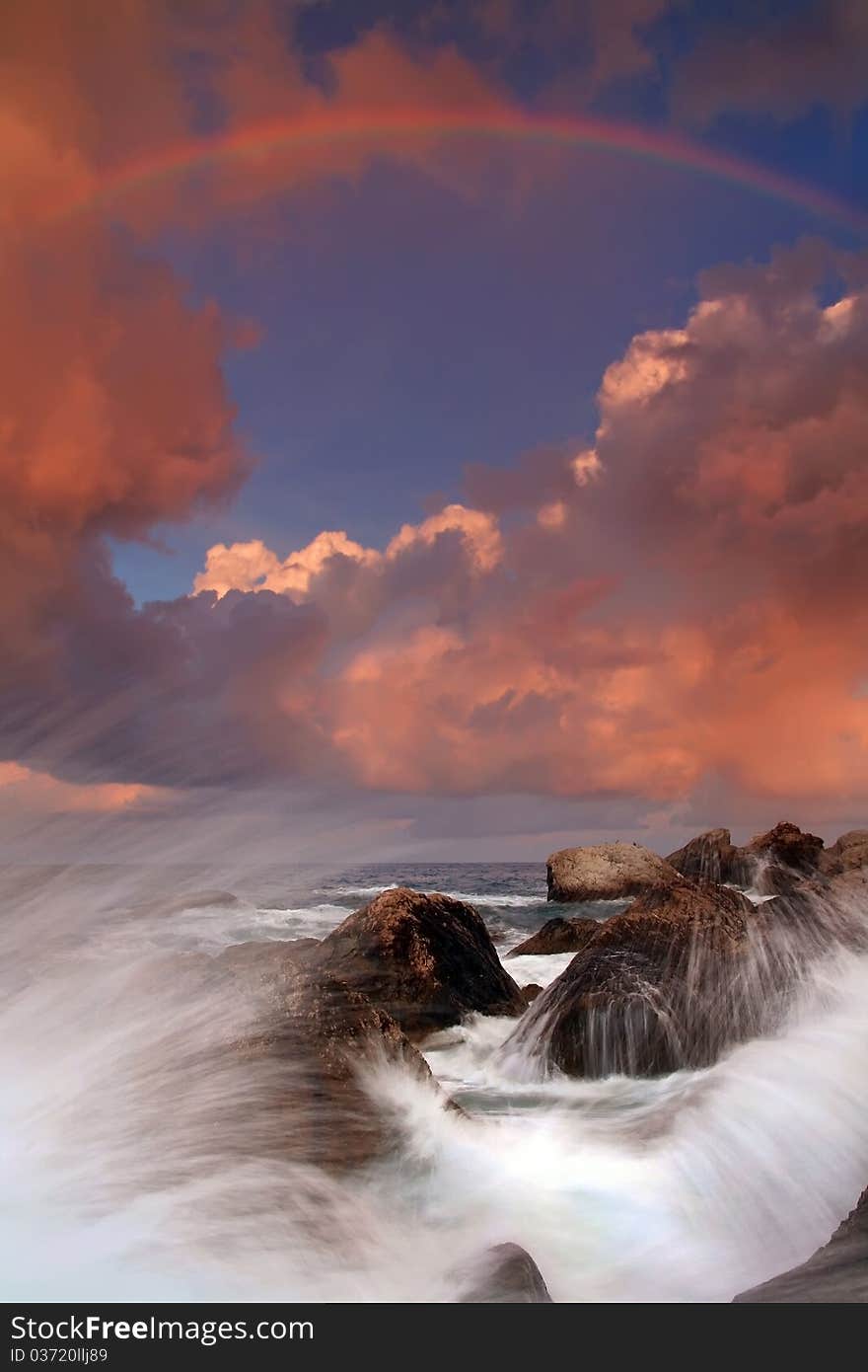 Rainbow over stormy sea