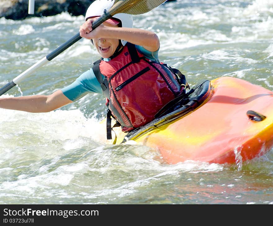 An active kayaker on the rough water