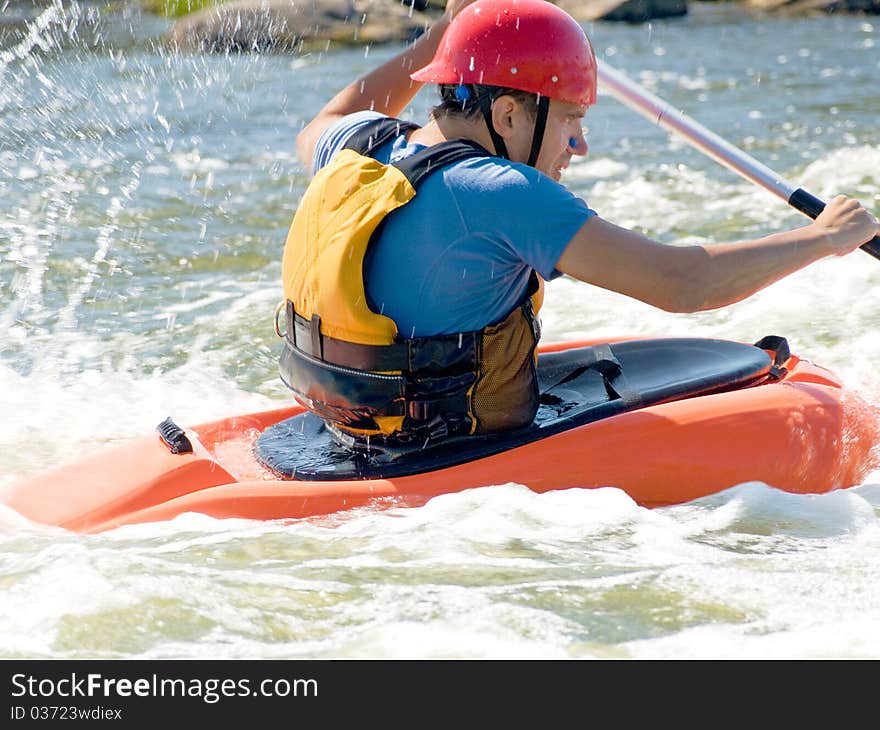 An active kayaker on the rough water