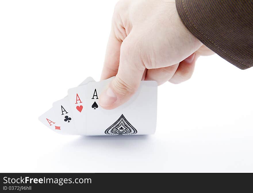 Player hand revealing four aces on white background