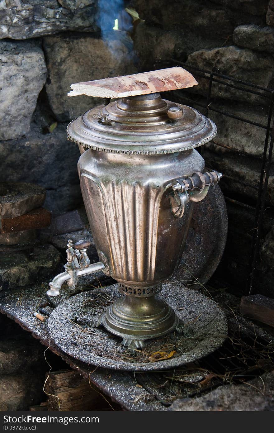 The antiquarian russian samovar with smoke