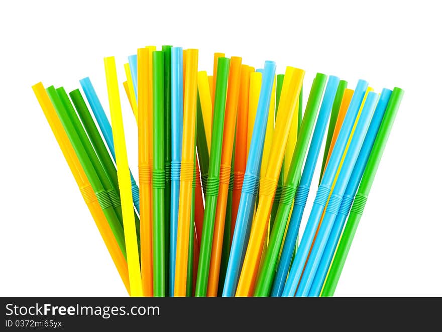Colorful cocktail straws against a white background