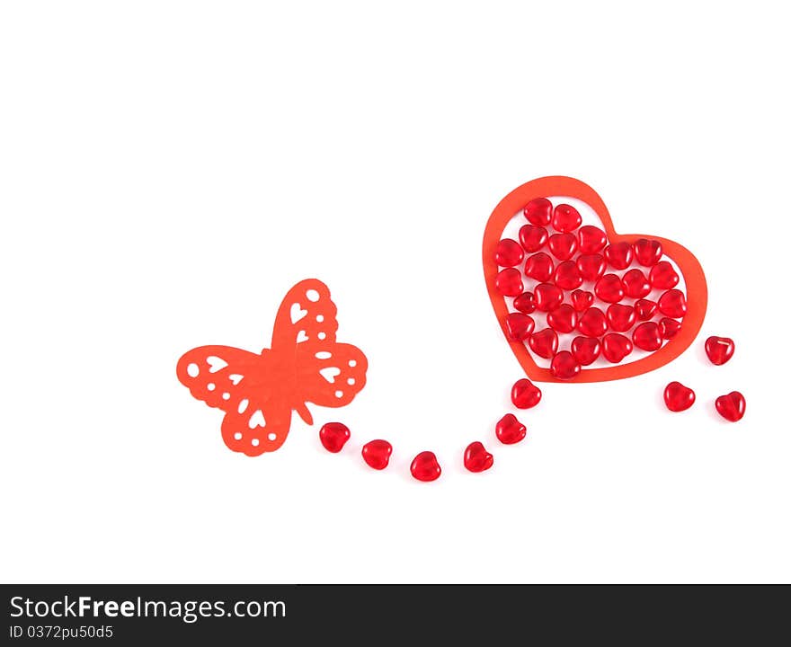 Red hearts, butterfly and red beads on white background. Red hearts, butterfly and red beads on white background