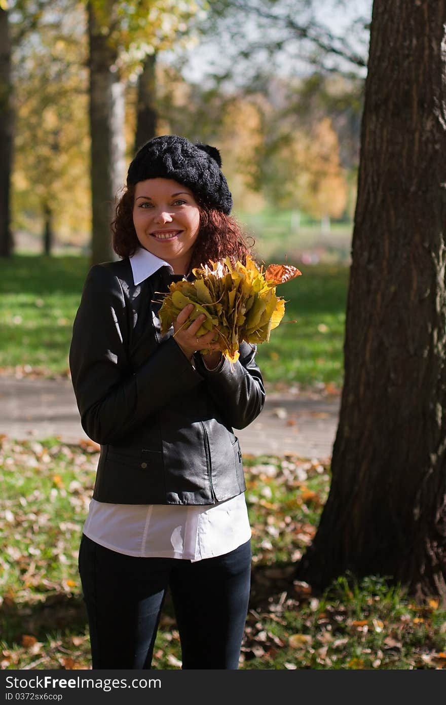 Curly beautiful girl autumn smiling